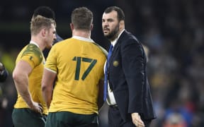 Australia's head coach Michael Cheika (R) reacts after losing the final match of the 2015 Rugby World Cup between New Zealand and Australia at Twickenham stadium, south west London, on October 31, 2015.