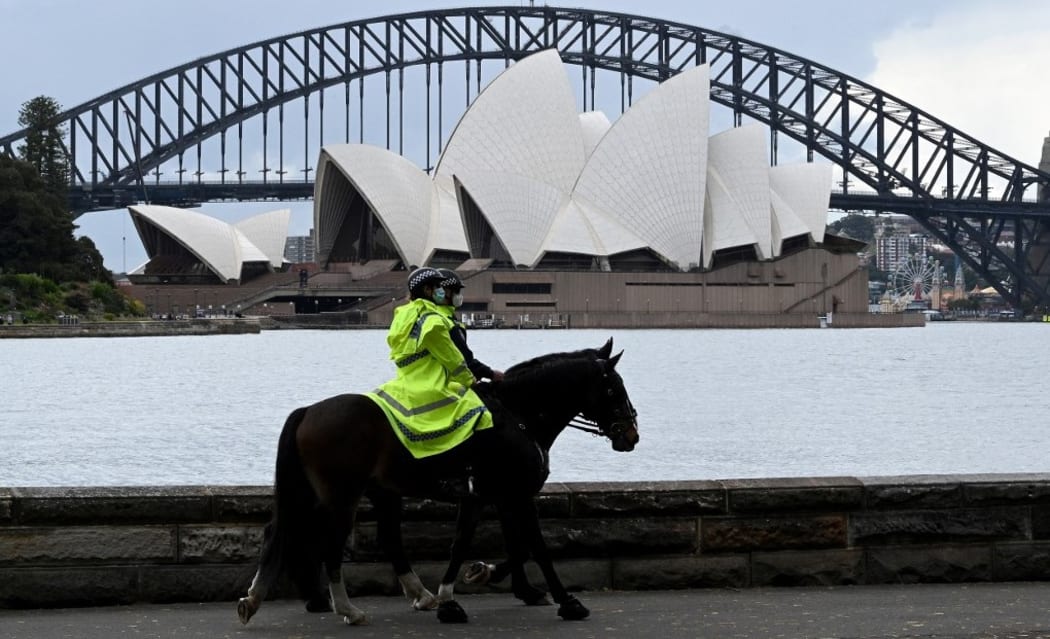 Policer offers patrol on their service horses in front of the Sydney Opera House on September 13, 2021 amid Covid-19 pendamic.