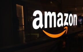 Amazon logo on black shiny wall in San Francisco mall in California on October 11, 2015.