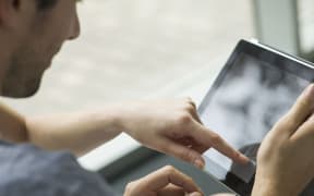 A couple using a tablet