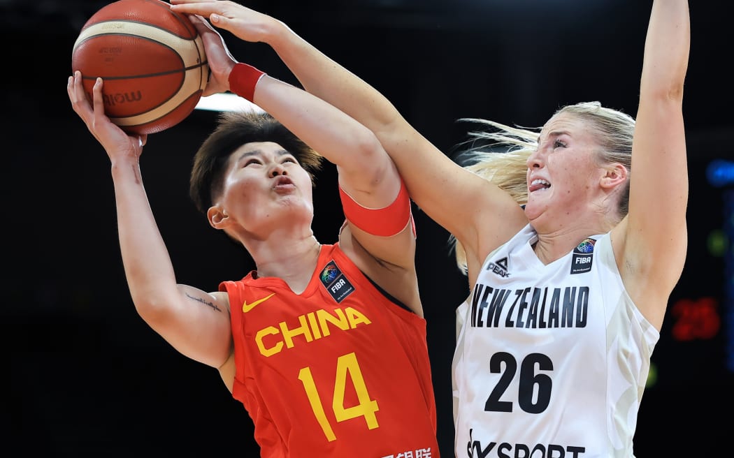 You Tang of China controls the ball against Tayla Dalton of New Zealand during the FIBA Women's Asia Cup, Sydney 2023.