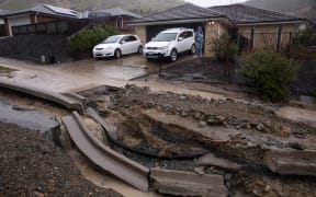 Flood waters have ripped open the road in Devenish Place, Atawhat, just north of Nelson