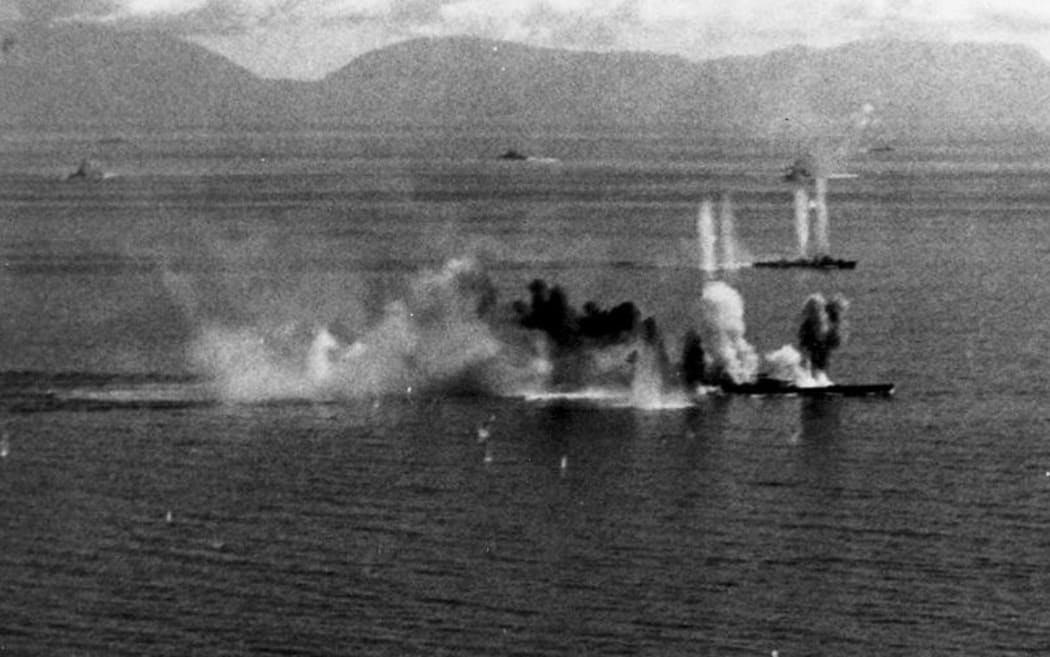 US Navy Task Force 38 aircraft attack Japanese battleship Musashi (foreground) and a destroyer in the Sibuyan Sea, 24 October 1944.