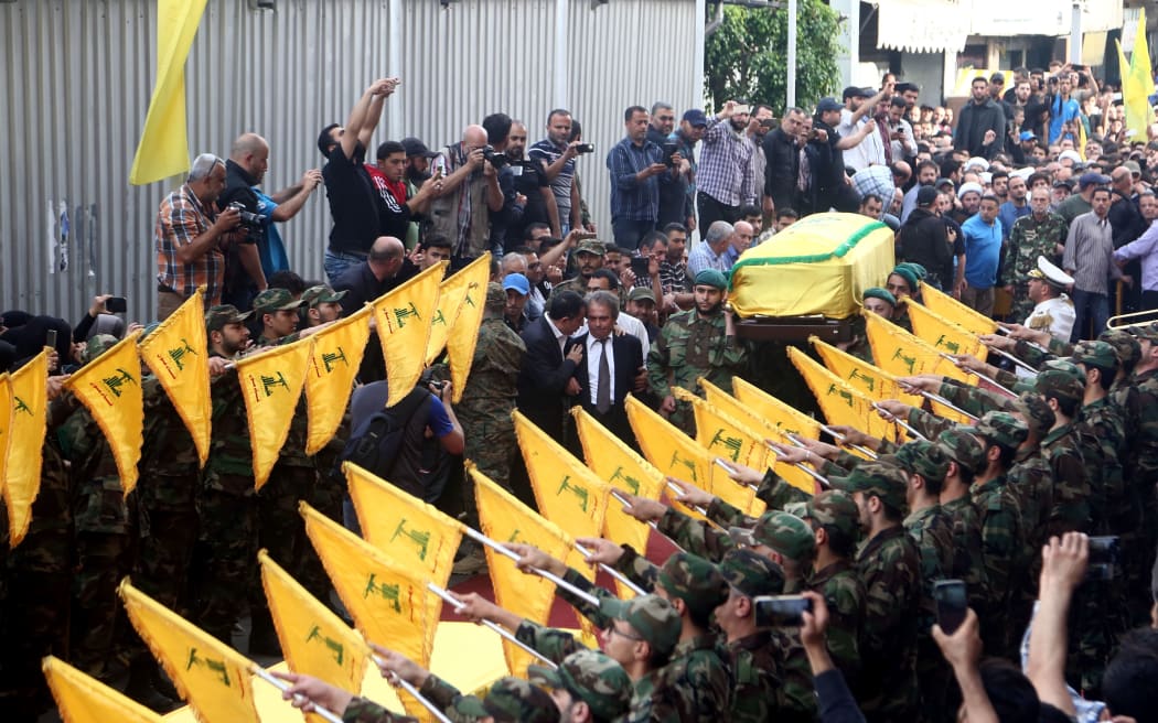 The coffin of Mustafa Badreddine, is being carried through the Hezbollah controlled Dahiyeh district of Beirut.