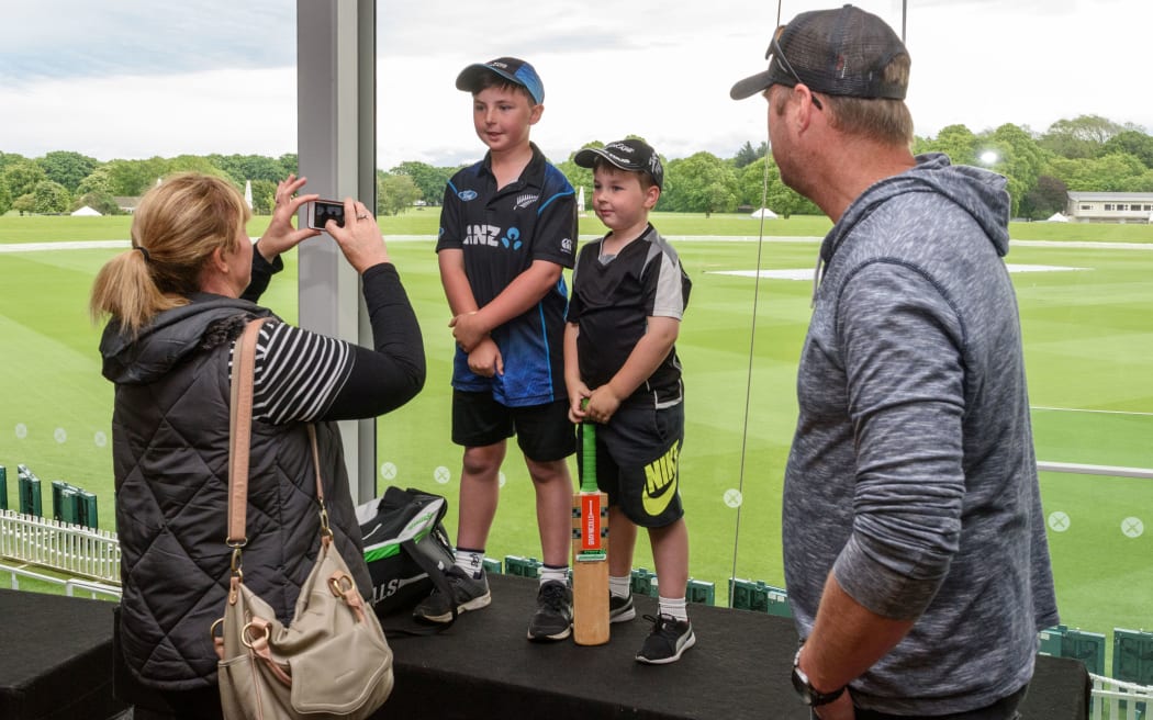 Young Blackcaps fans pose for their parents.
