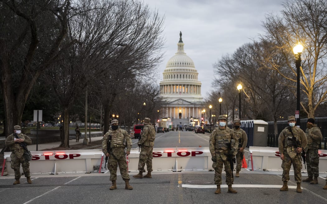 Members of the US National Guard stand watch at the US Capitol in Washington, DC on January 17, 2021, during a nationwide protest called by anti-government and far-right groups supporting US President Donald Trump and his claim of electoral fraud in the November 3 presidential election.