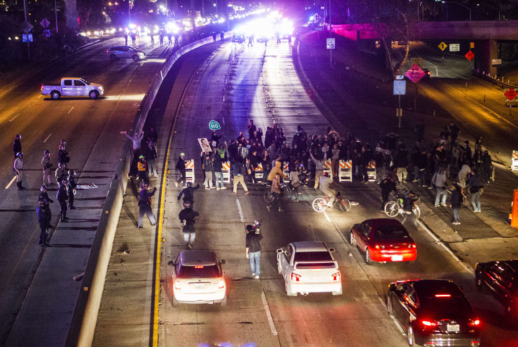 Demonstrators block a freeway in Los Angeles during demonstrations against the Ferguson, Missouri decision.