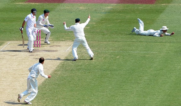 Michael Clarke (right) takes a successful catch off Scott Borthwick (left) at the Sydney Cricket Ground.