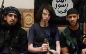 A Twitter image posted in December 2014 appears to show Jake Bilardi (centre) with two men believed to be IS members.