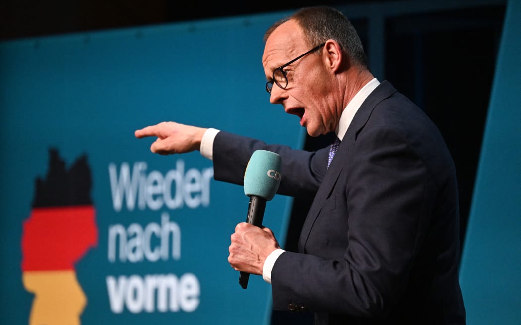 Friedrich Merz, the leader of conservative Christian Democratic Union (CDU) and candidate for Chancellor, speaks at an election campaign event on February 20, 2025 in Darmstadt, western Germany, three days before the parlimentary elections. (Photo by Kirill KUDRYAVTSEV / AFP)