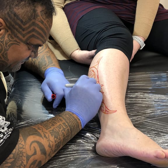 Arekatera Maihi is one of the moko artists at their moko studio at NZMACI.