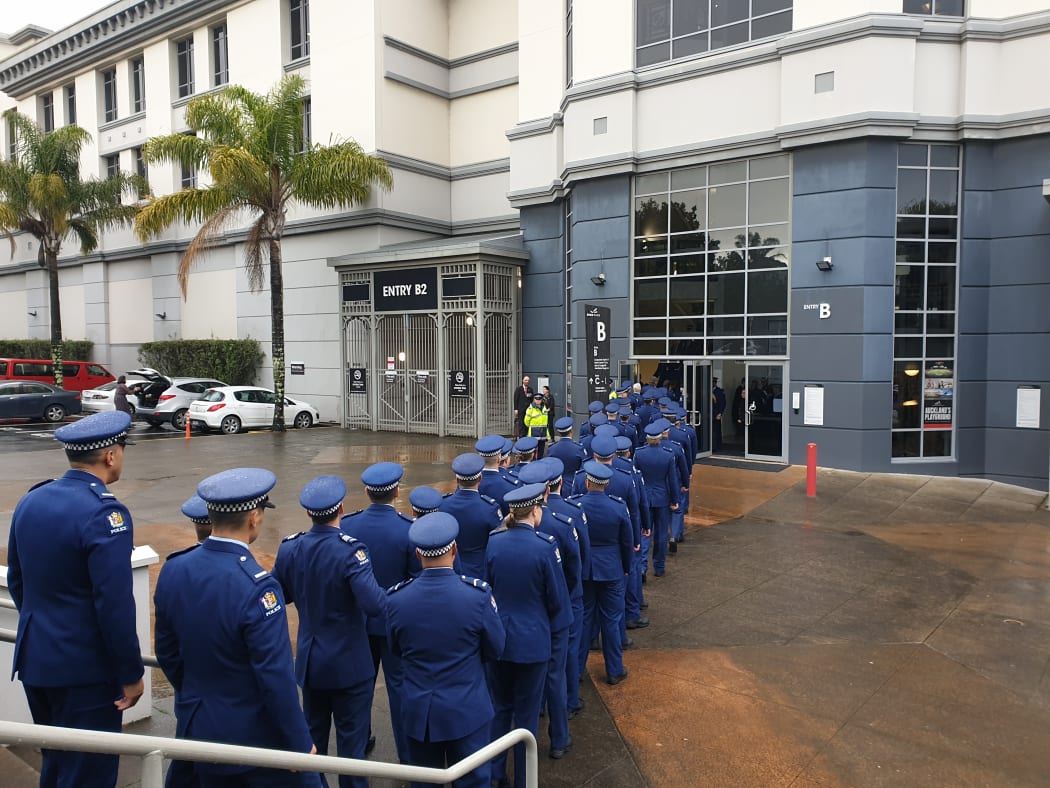 Police officers file into the venue where the funeral service of Constable Matthew Hunt is being held.
