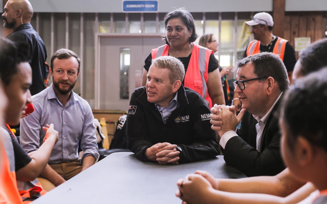 Prime Minister Chris Hipkins, centre, Emergency Management Minister Kieran McAnulty, left, and Finance Minister Grant Robertson at the Moana Nui A Kiwa Hub, for the south Auckland response to the flooding, in Māngere, 1 Febraury 2023.
