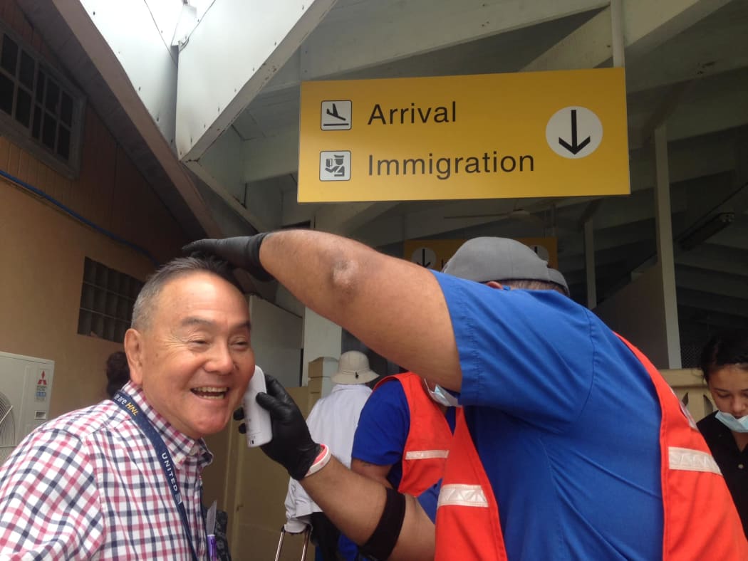 Ministry of Health staff screening all arriving passengers at Amata Kabua International Airport in Majuro