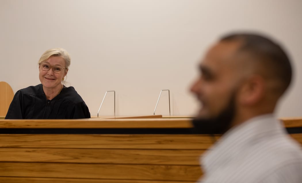 Judge Ema Aitken looks on as recovering drug addict and offender Mike graduates from the Drug Court in Auckland