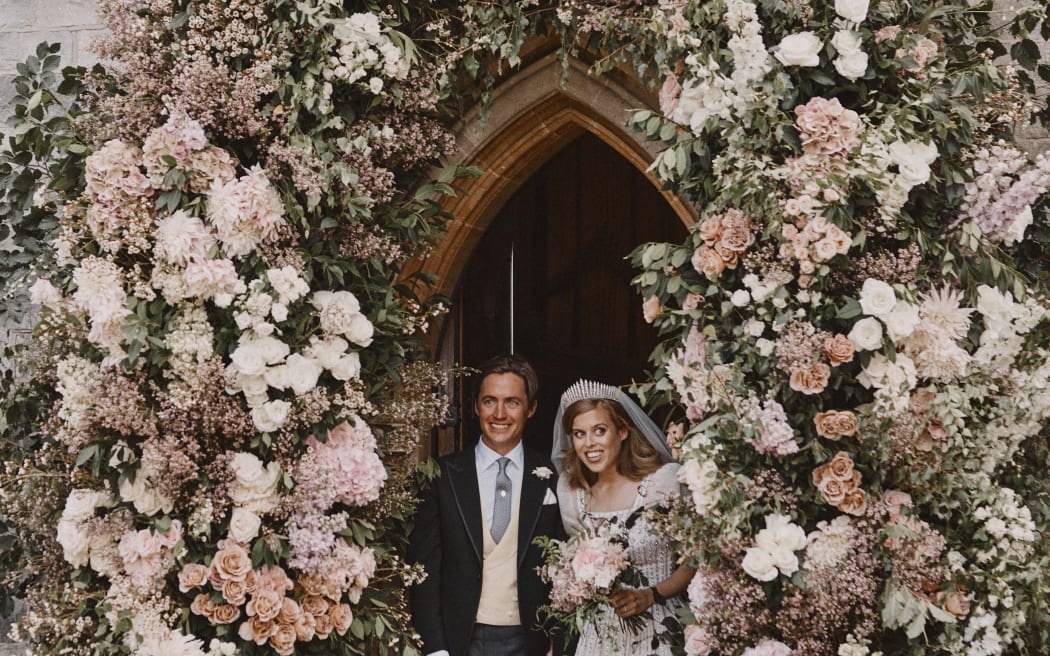 Britain's Princess Beatrice of York and her husband Edoardo Mapelli Mozzi leave The Royal Chapel of All Saints at Royal Lodge, Windsor, west of London, on July 17, 2020 after their marriage ceremony.