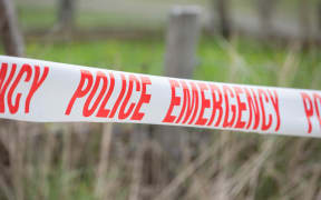 Police tape cordon a property in Taharoa