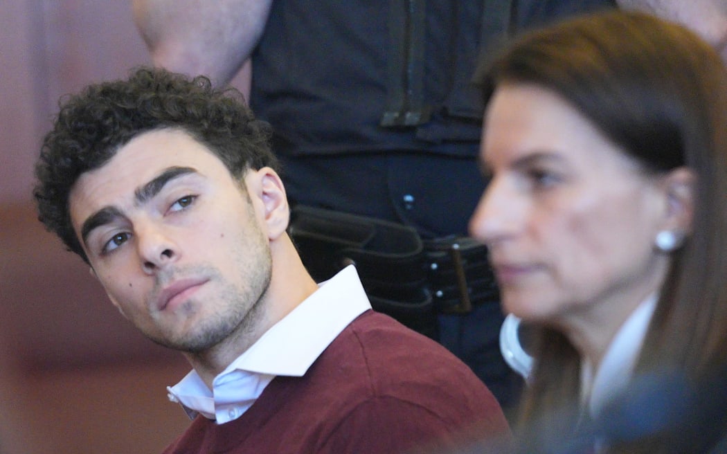 Luigi Mangione appears in Manhattan Supreme Court in New York on December 23, 2024, to face murder charges for shooting UHC CEO Brian Thompson to death. - Mangione, 26, is accused of shooting UnitedHealthcare chief executive Brian Thompson on a Manhattan street on December 4. (Photo by Curtis Means / POOL / AFP)
