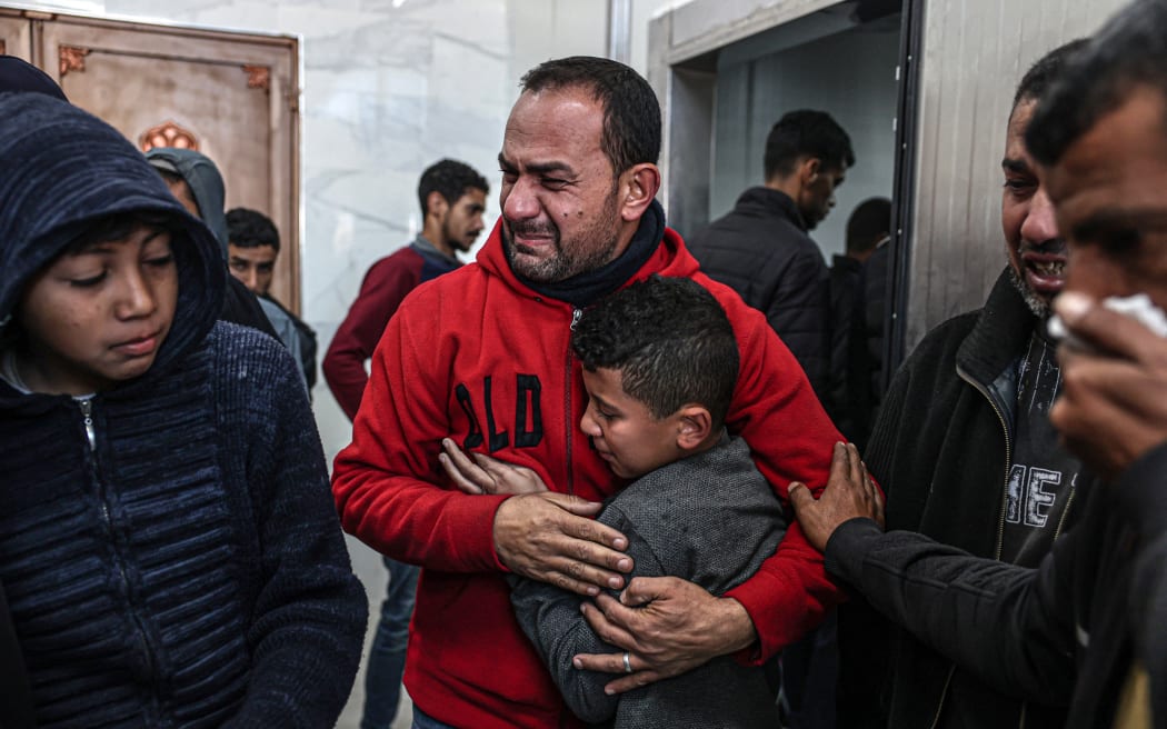 Relatives of Palestinians killed during Israeli bombardment, mourn their loved ones at the European hospital in Khan Yunis in the southern Gaza Strip, on January 6, 2024, amid continuing battles between Israel and the Palestinian militant group Hamas. (
