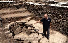 Archeologist of the Israel Antiquities Authority Jacob Vardi is pictured at the site of a settlement from the Neolithic Period (New Stone Age), discovered during archaeological excavations.