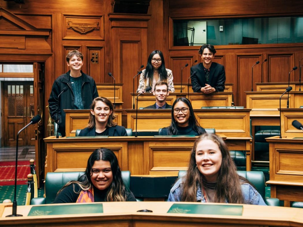Molly Doyle (front right) is the Youth MP for Green Party co-leader and Minister of Climate Change James Shaw. Doyle is surrounded by the other Youth MPs representing the Green Party including Luke Wijohn (far right back).