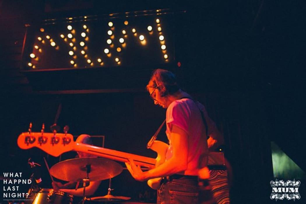 Bassist of The Shocking Pinks performing at MUM Club night