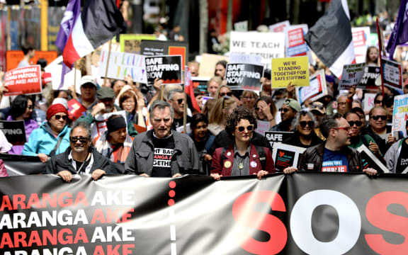 People march through central Auckland as part of Thursday's mega strike.