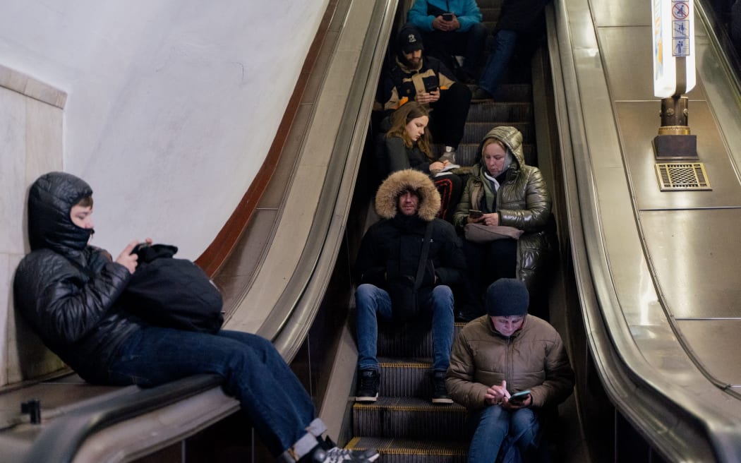 Local residents take shelter in a metro station during an air strike alarm in Kyiv, on November 28, 2024, amid the Russian invasion of Ukraine. (Photo by Tetiana DZHAFAROVA / AFP)
