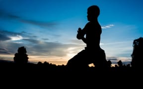 A man practising yoga