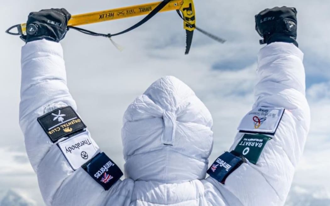 Hari Budha Magar stands victorious atop Mt Everest as the first ever double above-knee amputee to scale the world's tallest mountain.