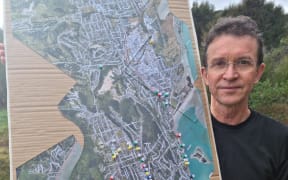 Nelsust convener Peter Olorenshaw with a map of Nelson depicting hazardous spots for walkers and cyclists.