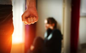 Man beating up his wife illustrating domestic violence