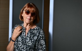 Gisele Pelicot walks during an interuption at the Avignon courthouse as she attends the trial of her former partner Dominique Pelicot accused of drugging her for nearly ten years and inviting strangers to rape her at their home in Mazan, a small town in the south of France, in Avignon, on September 17, 2024. A court in the southern town of Avignon is trying Dominique Pelicot, a 71-year-old retiree, for repeatedly raping and enlisting dozens of strangers to rape his heavily sedated wife in her own bed over a decade. Fifty other men, aged between 26 and 74, are also on trial for alleged involvement, in a case that has horrified France. The court proceedings, which runs until December, are open to the public at the request of Dominique Pelicot's ex-wife and victim. (Photo by Christophe SIMON / AFP)