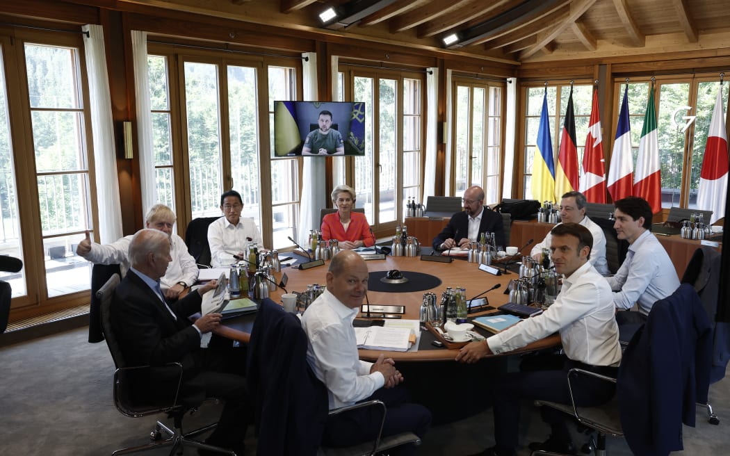 (From centre, clockwise)  G7 leaders Germany's Chancellor Olaf Scholz, US President Joe Biden, UK Prime Minister Boris Johnson, Japan's Prime Minister Fumio Kishida, European Commission President Ursula von der Leyen, European Council President Charles Michel, Italy's Prime Minister Mario Draghi, Canada's Prime Minister Justin Trudeau and France's President Emmanuel Macron around the table, where Ukraine's President Volodymyr Zelensky addressed the group via video link, 27 June, 2022, at Elmau Castle, southern Germany.