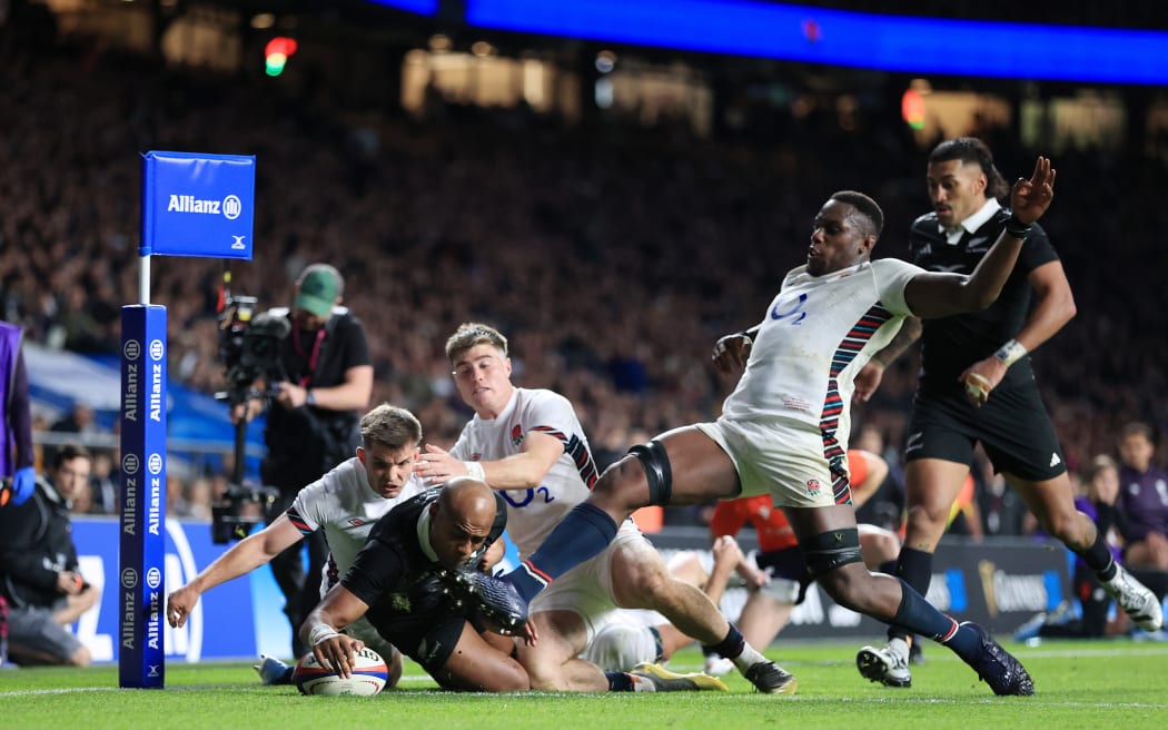 Mark Tele'a of New Zealand scores against England, 2024.