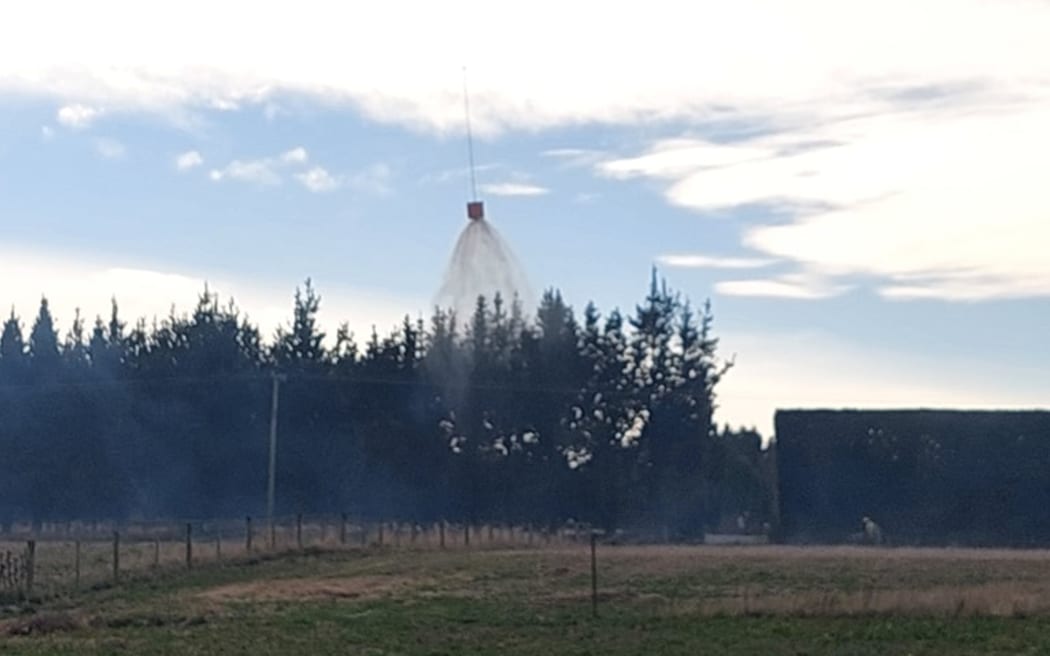 Water being dropped on a scrub fire in Canterbury on Saturday 1 June 2024.