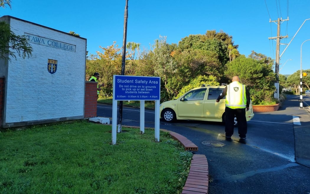 Security staff checking vehicles going into Tawa College.