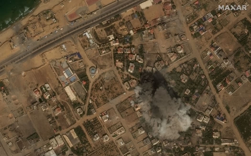 This handout satellite picture released by Maxar Technologies on 10 October, 2023 shows smoke rising after an airstrike by Israeli forces on Gaza City. Israel declared war on Hamas on October 8 following a shock land, air and sea assault by the Gaza-based Islamists.