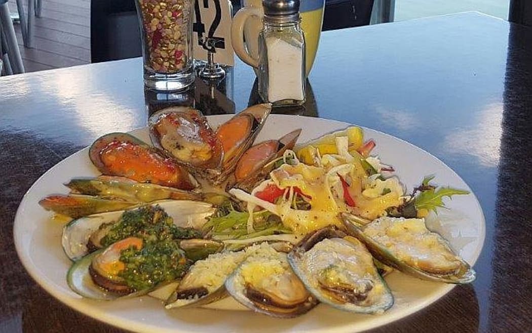 Cooked mussels presented on a plate