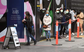 People queue at a Covid-19 coronavirus testing station in Melbourne on August 12, 2021 as five million people in Australia's second-largest city will remain under stay-at-home orders for at least another week.