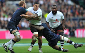 Josh Matavesi is tackled during Fiji's test against England at Twickenham in November.