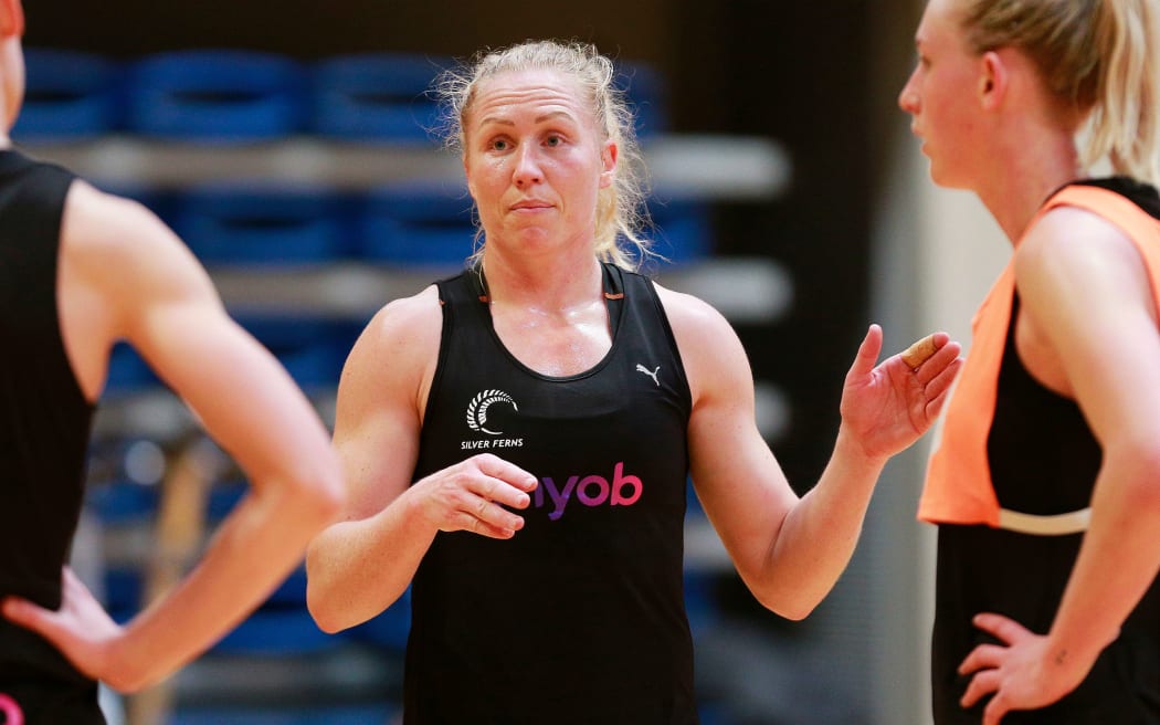 Laura Langman in a team discussion with defenders during Silver Ferns training