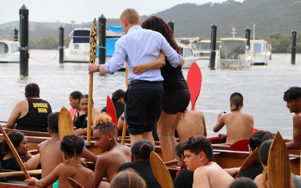 Prime Minister Chris Hipkins, who was wearing formal attire after meeting with Iwi-chairs, rolled up his suit pants to join rangatahi who were waka training at Waitangi on 3 February, 2023.
