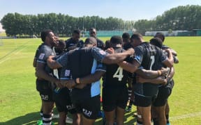 The Fiji sevens team huddle together during a training session in Dubai.