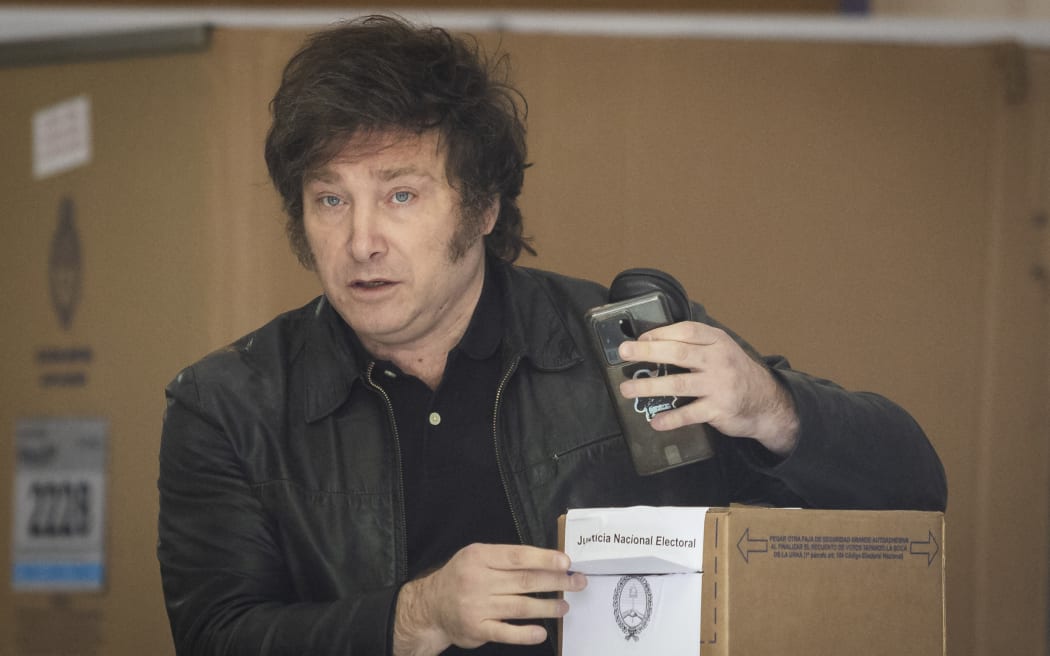 Argentine presidential candidate Javier Milei of La Libertad Avanza party votes during Argentina's runoff presidential election, in Buenos Aires, Argentina November 19, 2023.