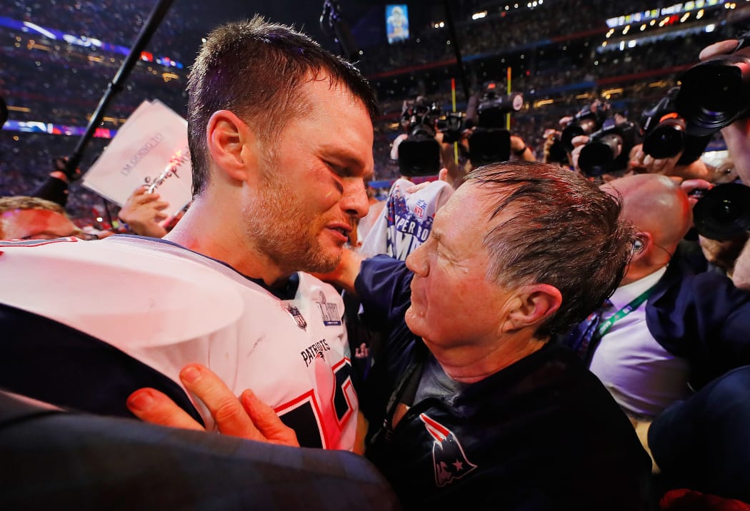 ATLANTA, GA - FEBRUARY 03: Tom Brady #12 of the New England Patriots talks to head coach Bill Belichick of the New England Patriots after the Patriots defeat the Rams 13-3 during Super Bowl LIII at Mercedes-Benz Stadium on February 3, 2019 in Atlanta, Georgia.   Kevin C. Cox/Getty Images/AFP