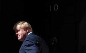 Britain's Prime Minister Boris Johnson turns outside 10 Downing Street in July 2109.