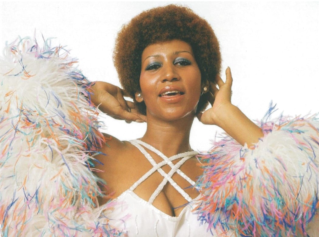Booklet image from 'Aretha Franklin: A Portrait of the Queen 1970-1974'. Aretha poses with feather boa.