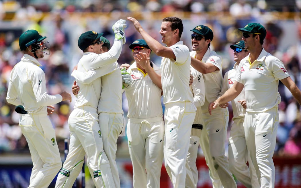 Australia celebrate their Ashes win at the WACA in Perth.