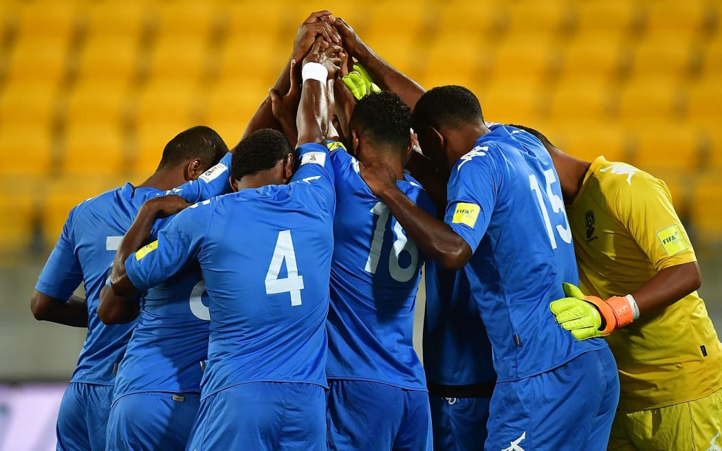 Fiji huddle together before their World Cup qualifying match against New Zealand.